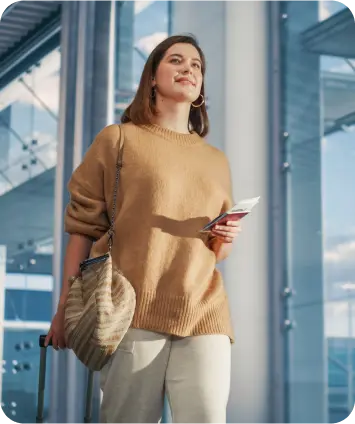 Traveller holding documents while preparing for a visa journey